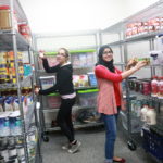 Picture of WCC staff stocking food pantry.
