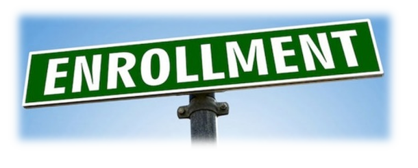 Green and white street sign with the word "enrollment" 