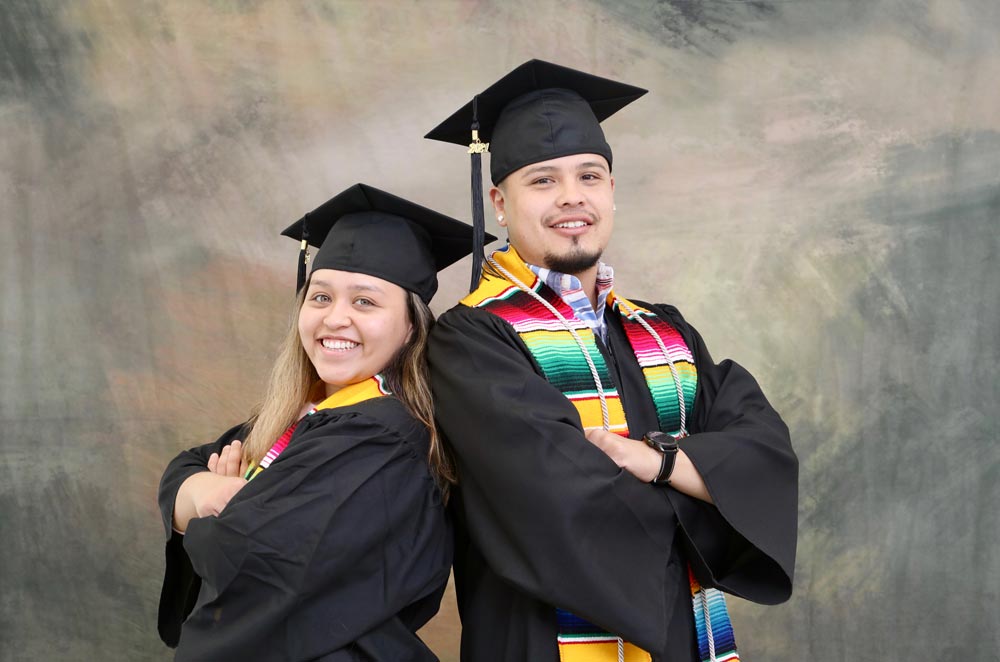 Two LCC Graduates in Cap and Gown