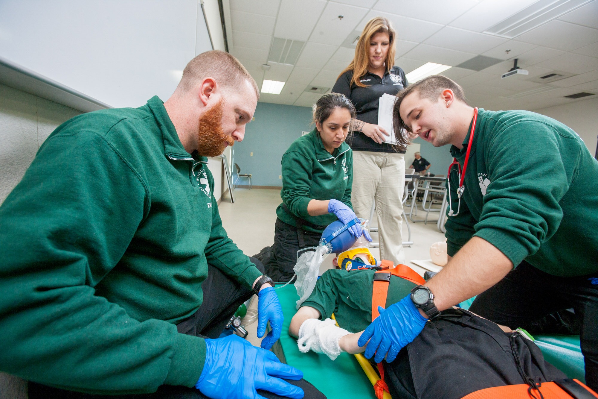 group of emt students practicing