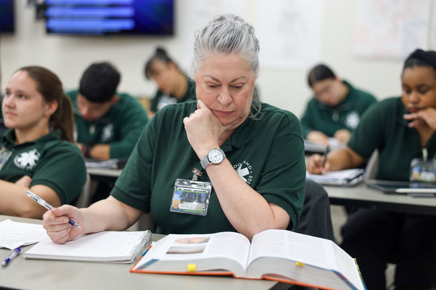 EMT Student studying textbook in lecture